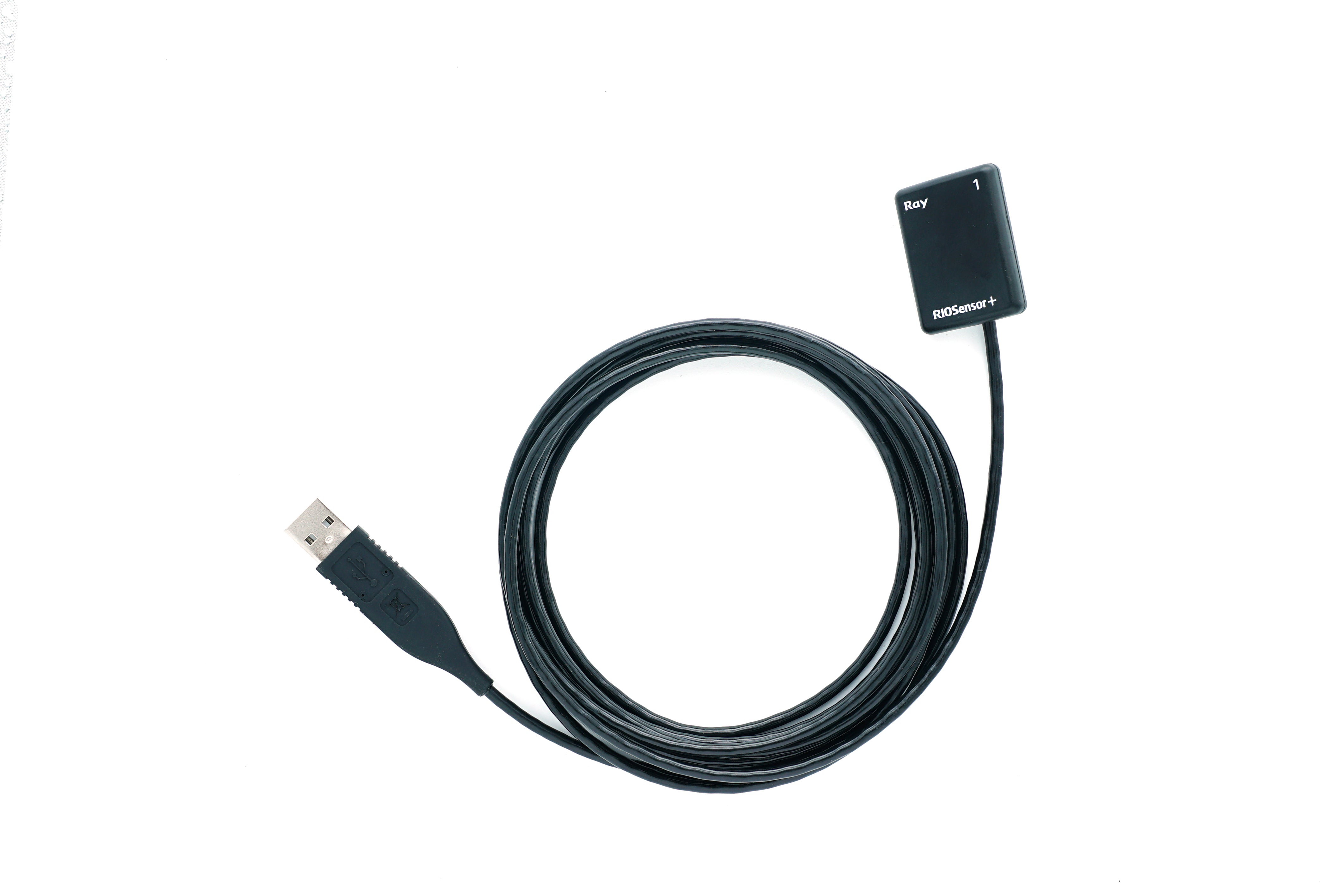 RIOSensor Plus digital dental sensor with USB cable coiled on a white background.