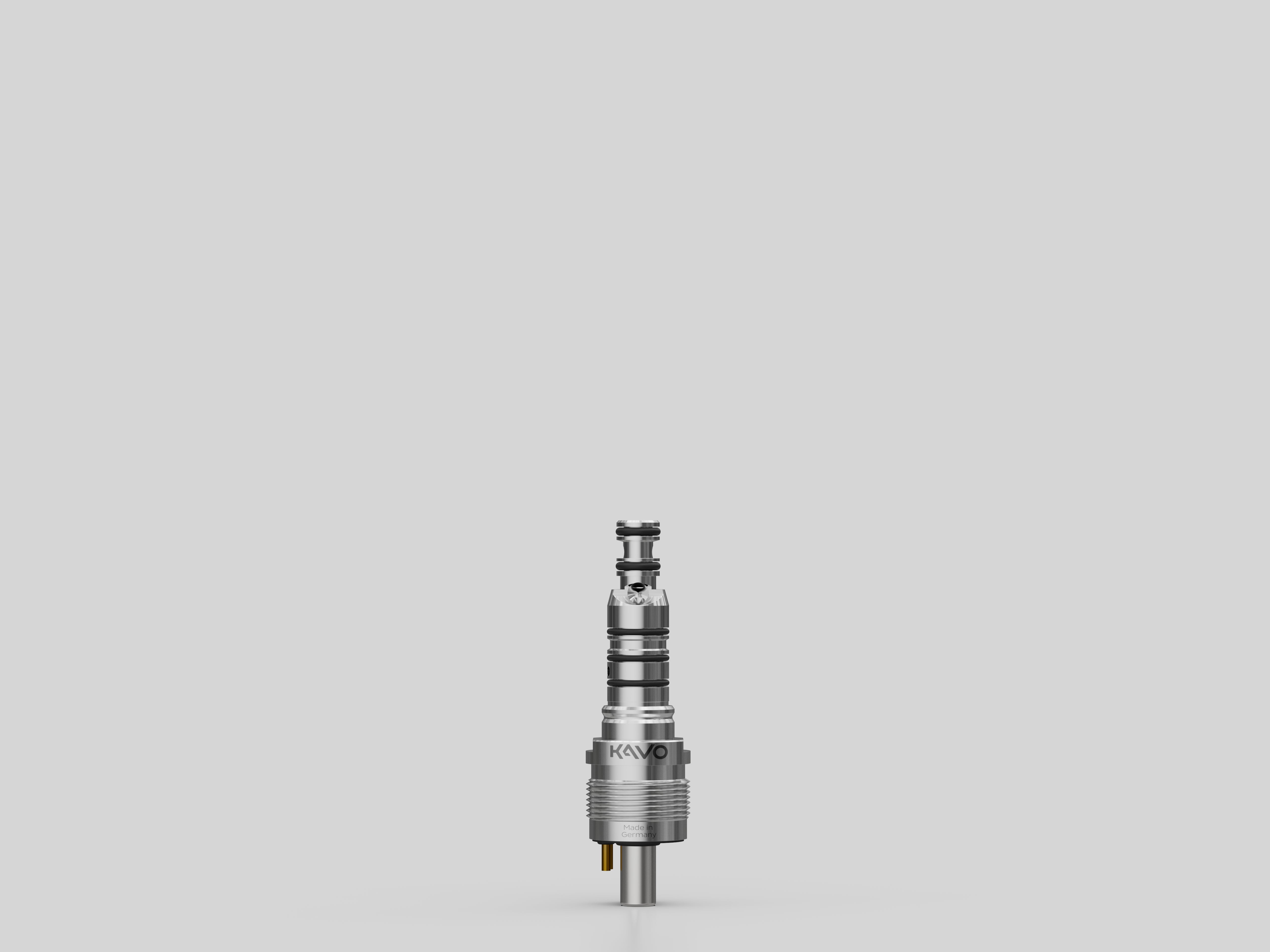 Silver KaVo MULTIflex 457 coupling on a light grey background.